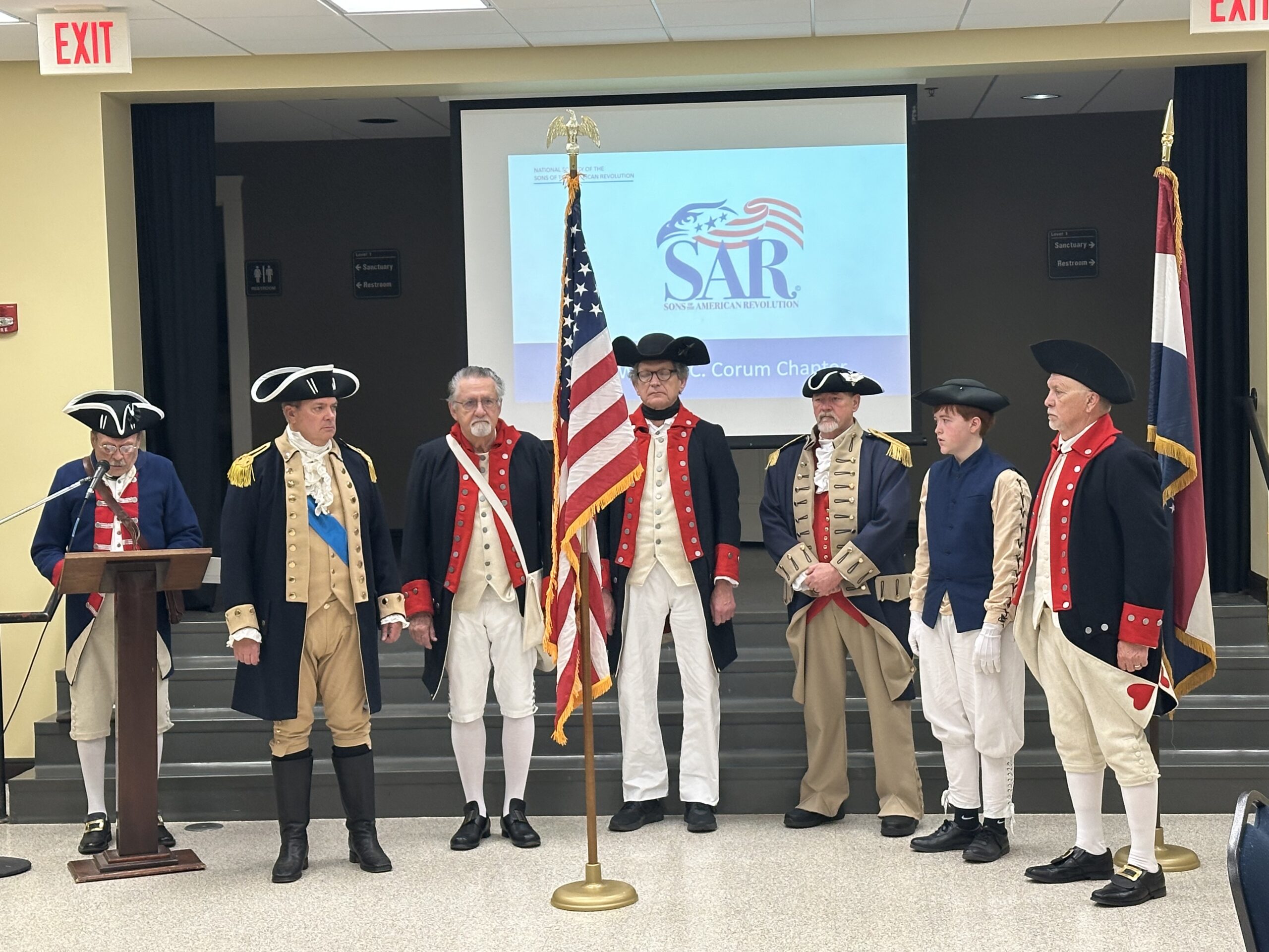 The newly formed chapter color guard is commissioned by Color Guard Commander Dewayne Knott and Past MO Society President Michael Robertson.